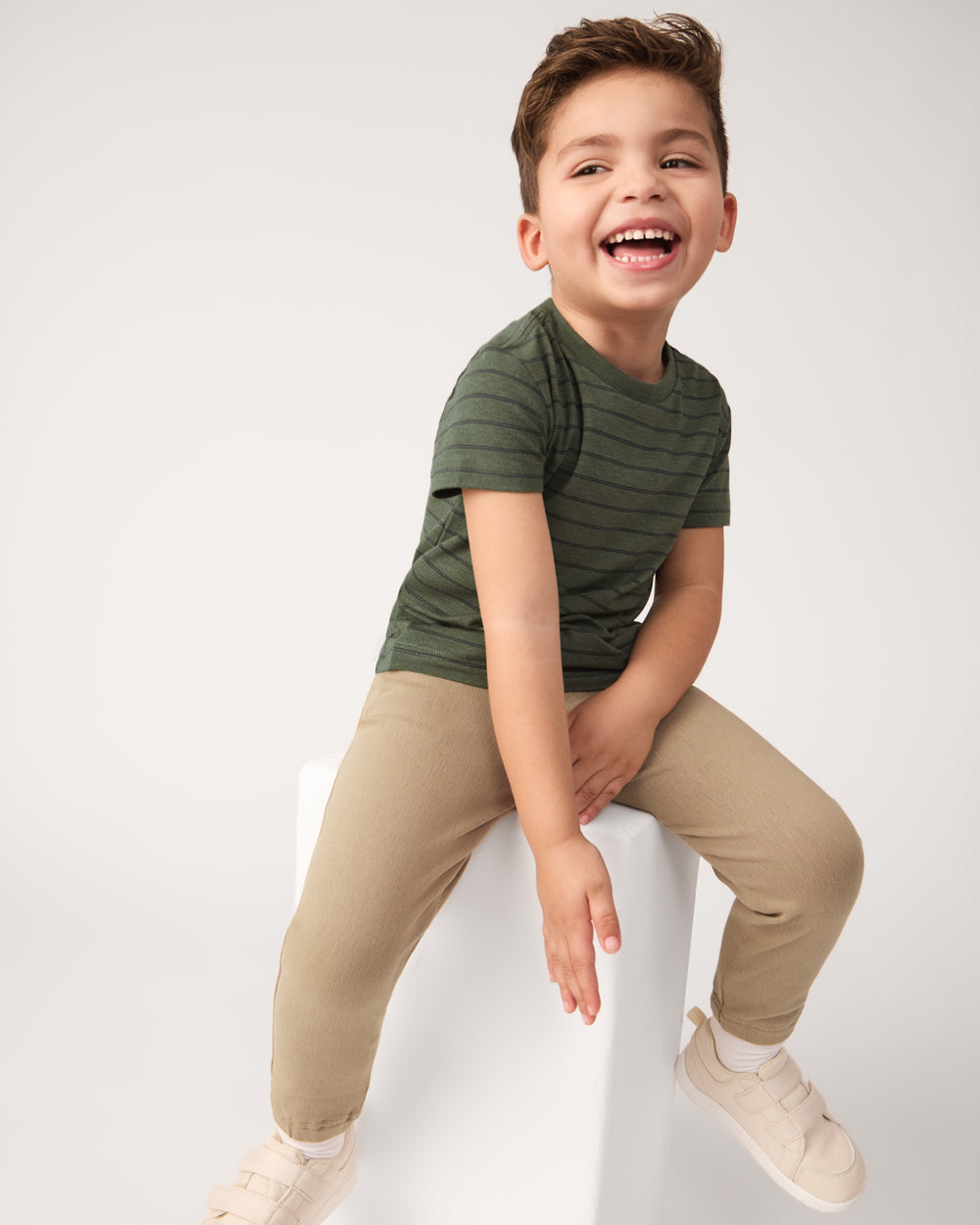 Boy wearing the Olive Stripes Short Sleeve Relaxed Tee with khaki pants