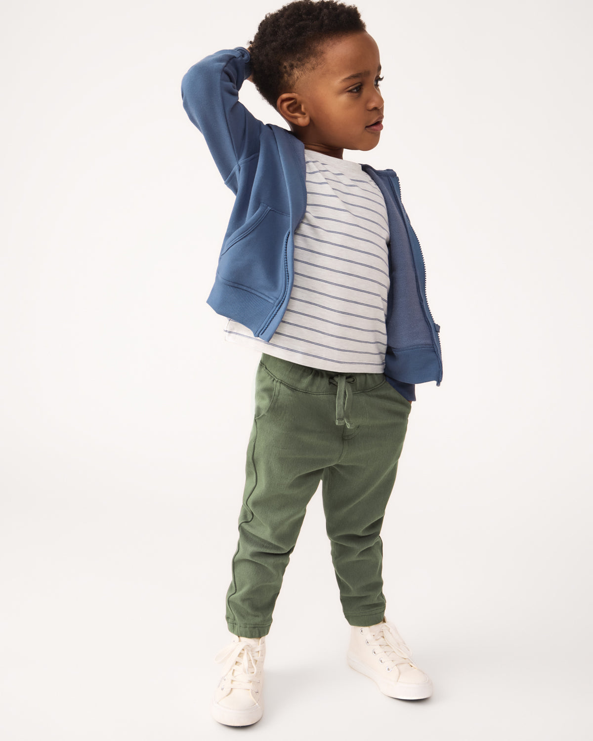 Boy wearing the Olive Denim Jogger with a striped tee