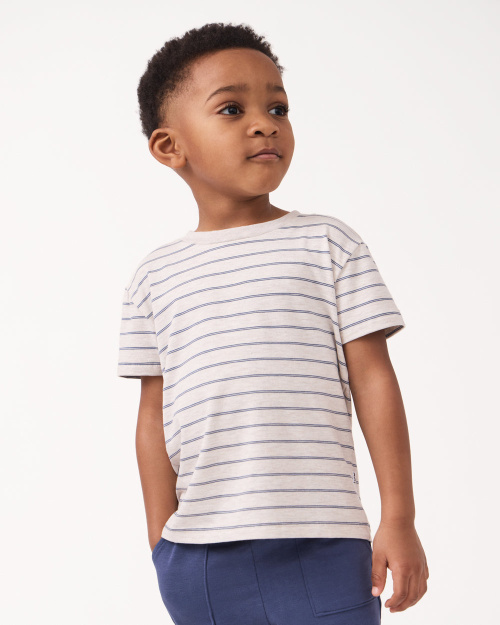 Front view of boy wearing the Stone Stripes Short Sleeve Relaxed Tee