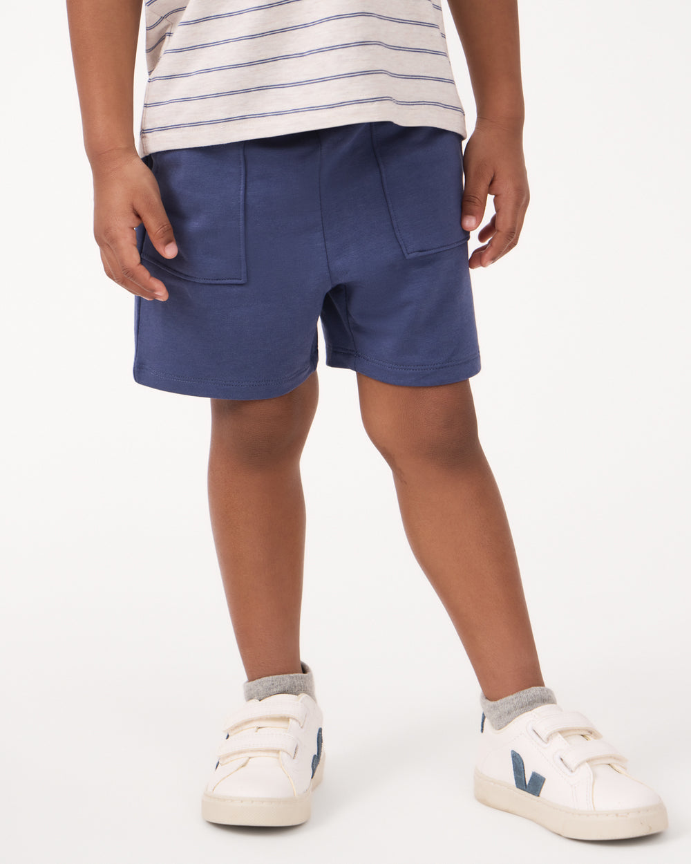 Close up of boy wearing the Vintage Navy Shorts