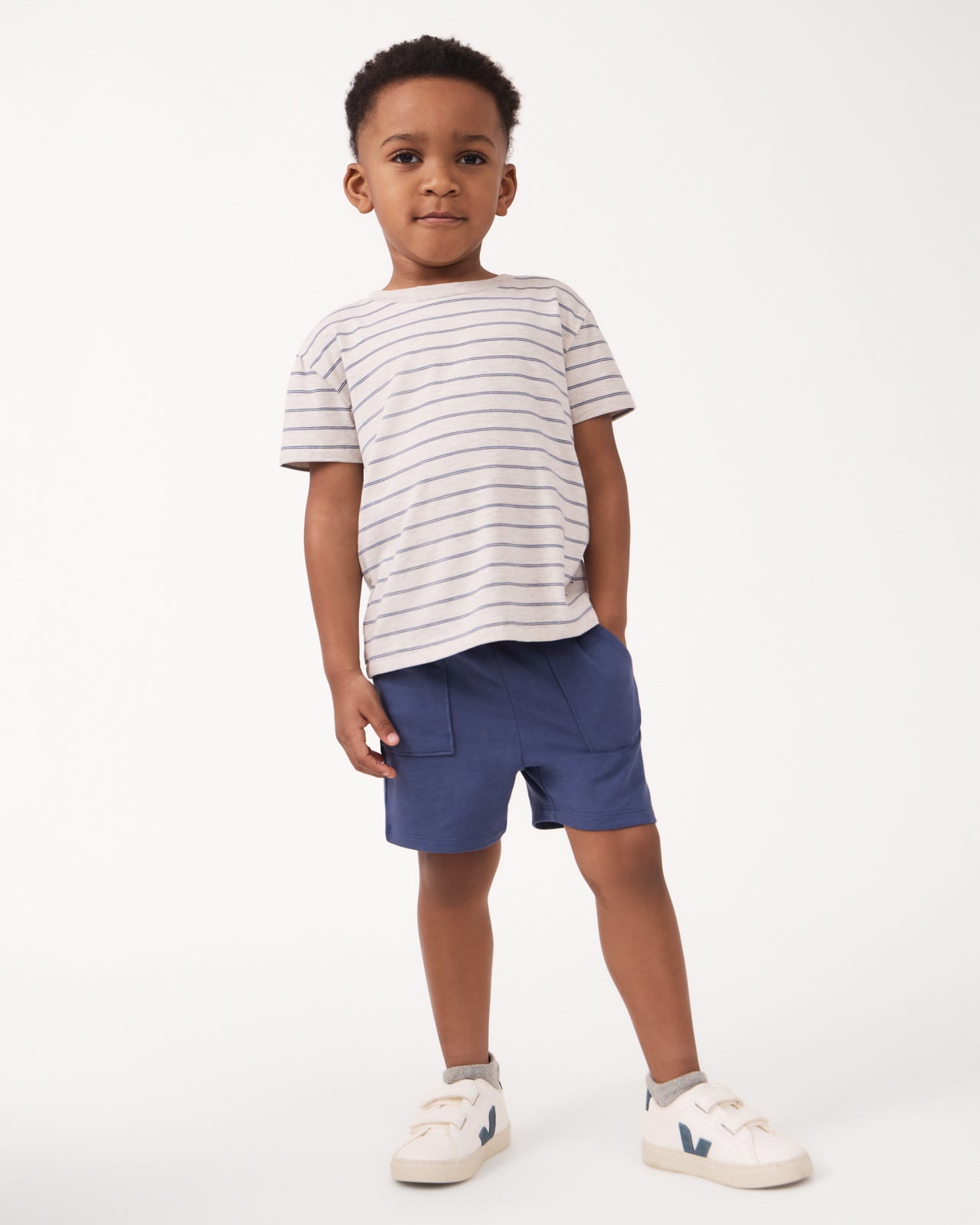 Boy wearing the Stone Stripes Short Sleeve Relaxed Tee with navy shorts