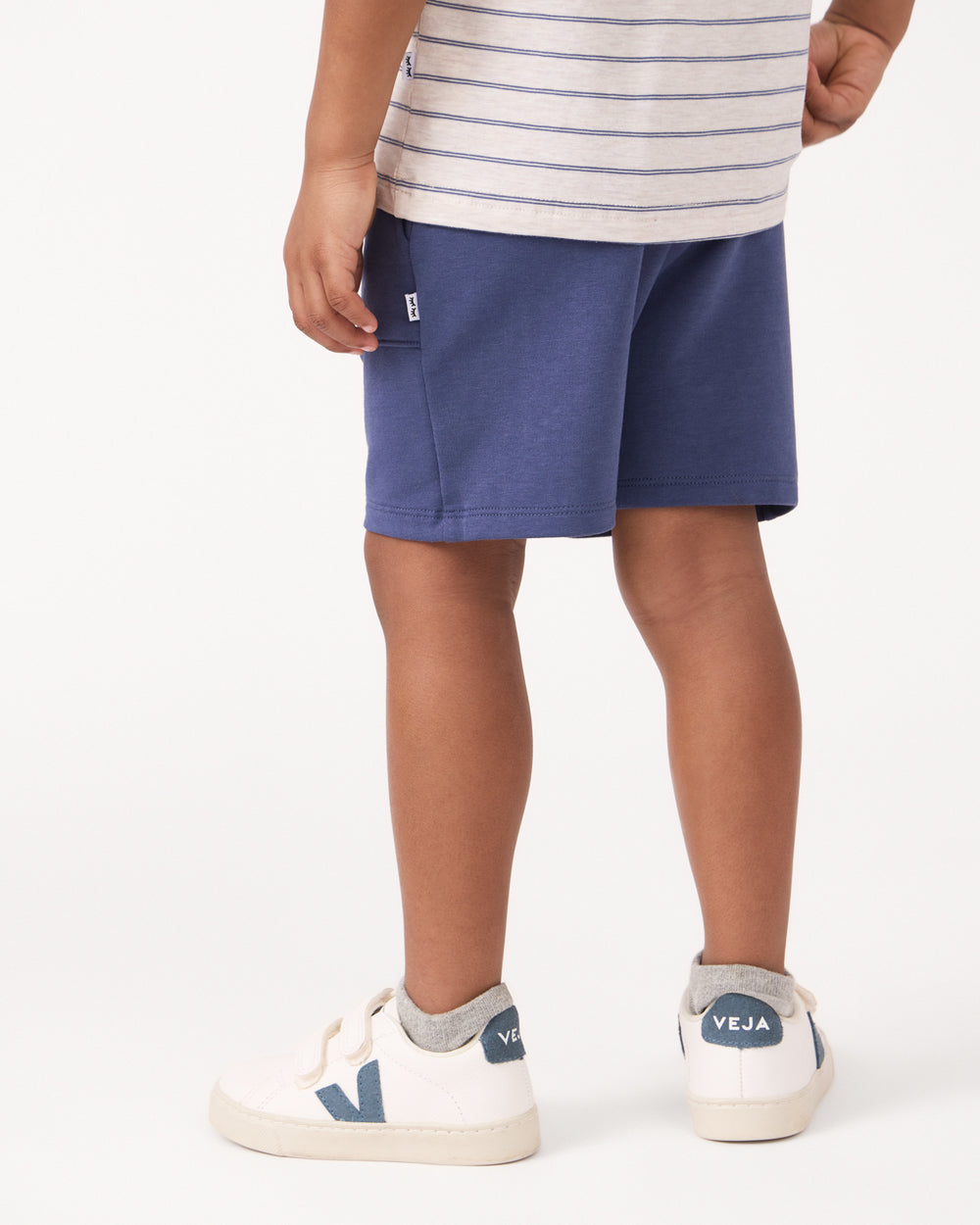 Back view of boy wearing the Vintage Navy Shorts