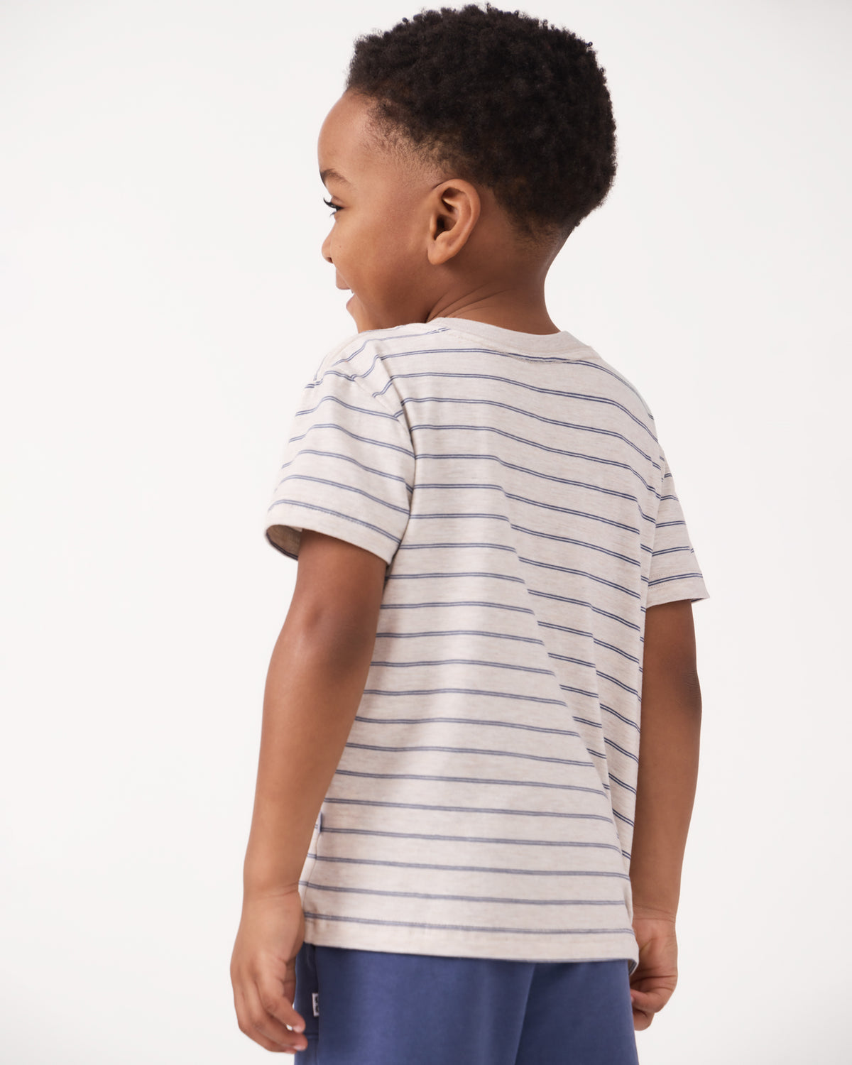 Back view of boy wearing the Stone Stripes Short Sleeve Relaxed Tee