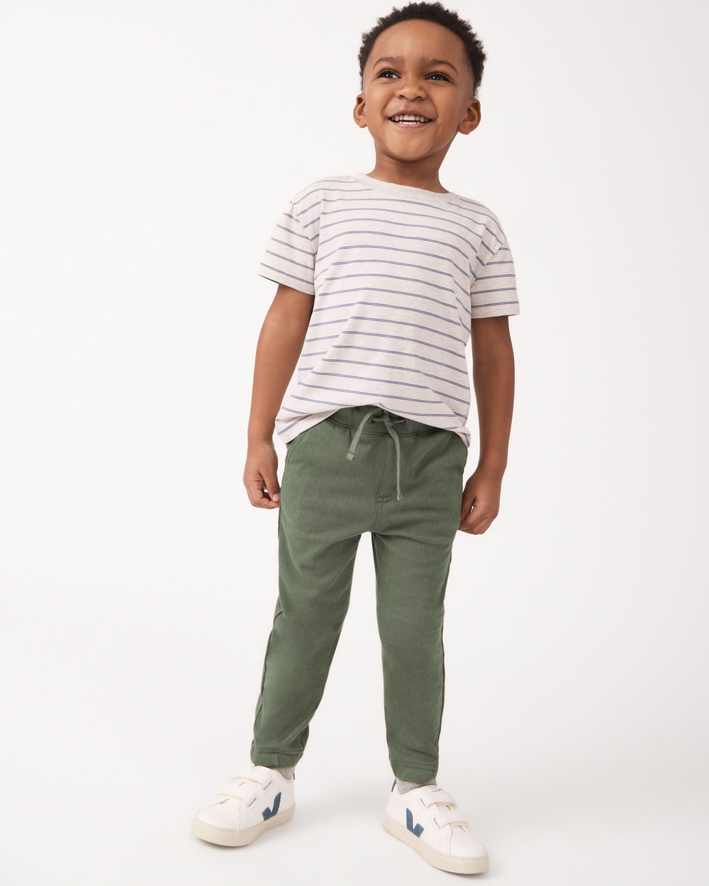 Boy wearing the Olive Denim Jogger with a short sleeve tshirt