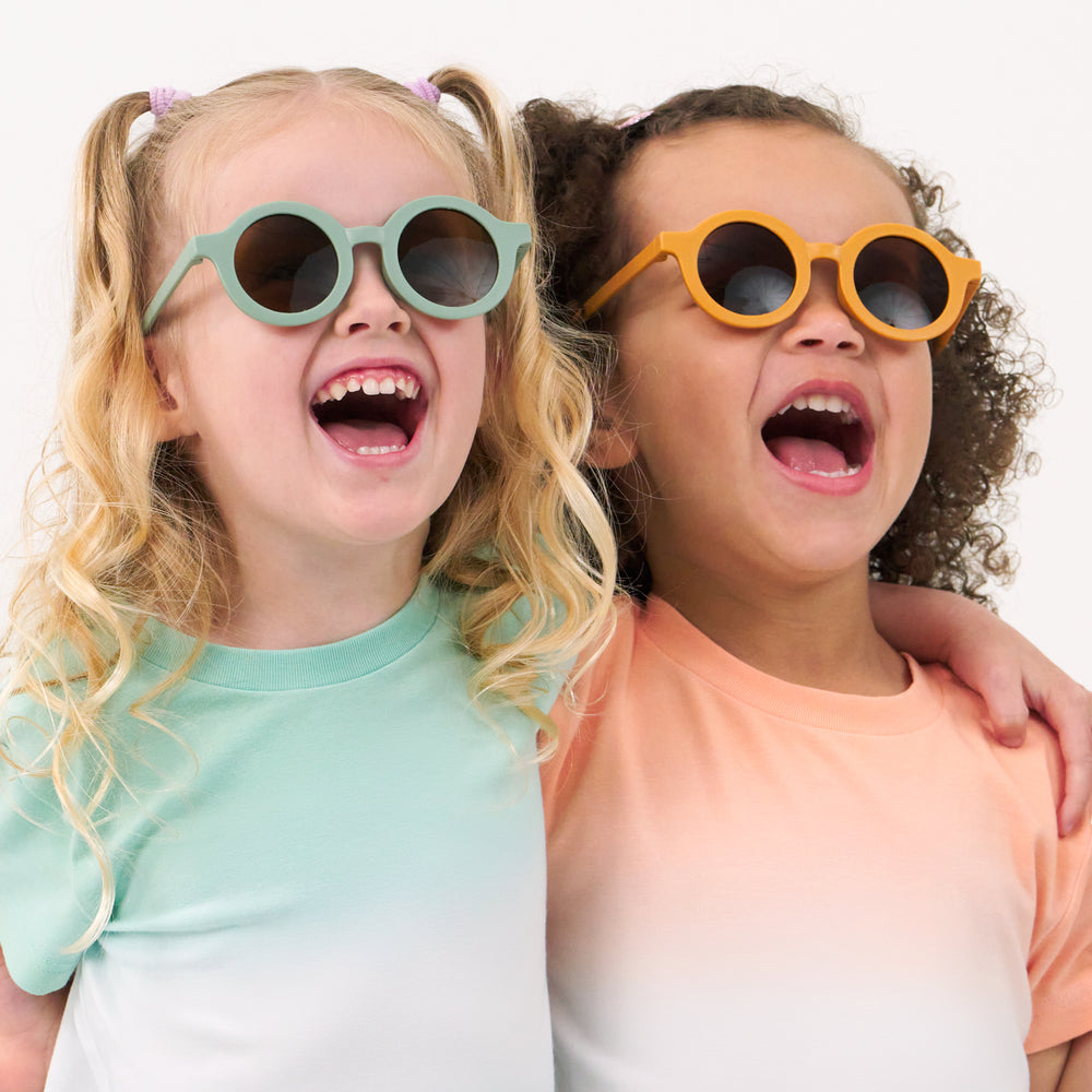 Close up image of two children wearing coordinating relaxed tees