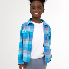 Smiling boy wearing the Arctic Plaid Shacket