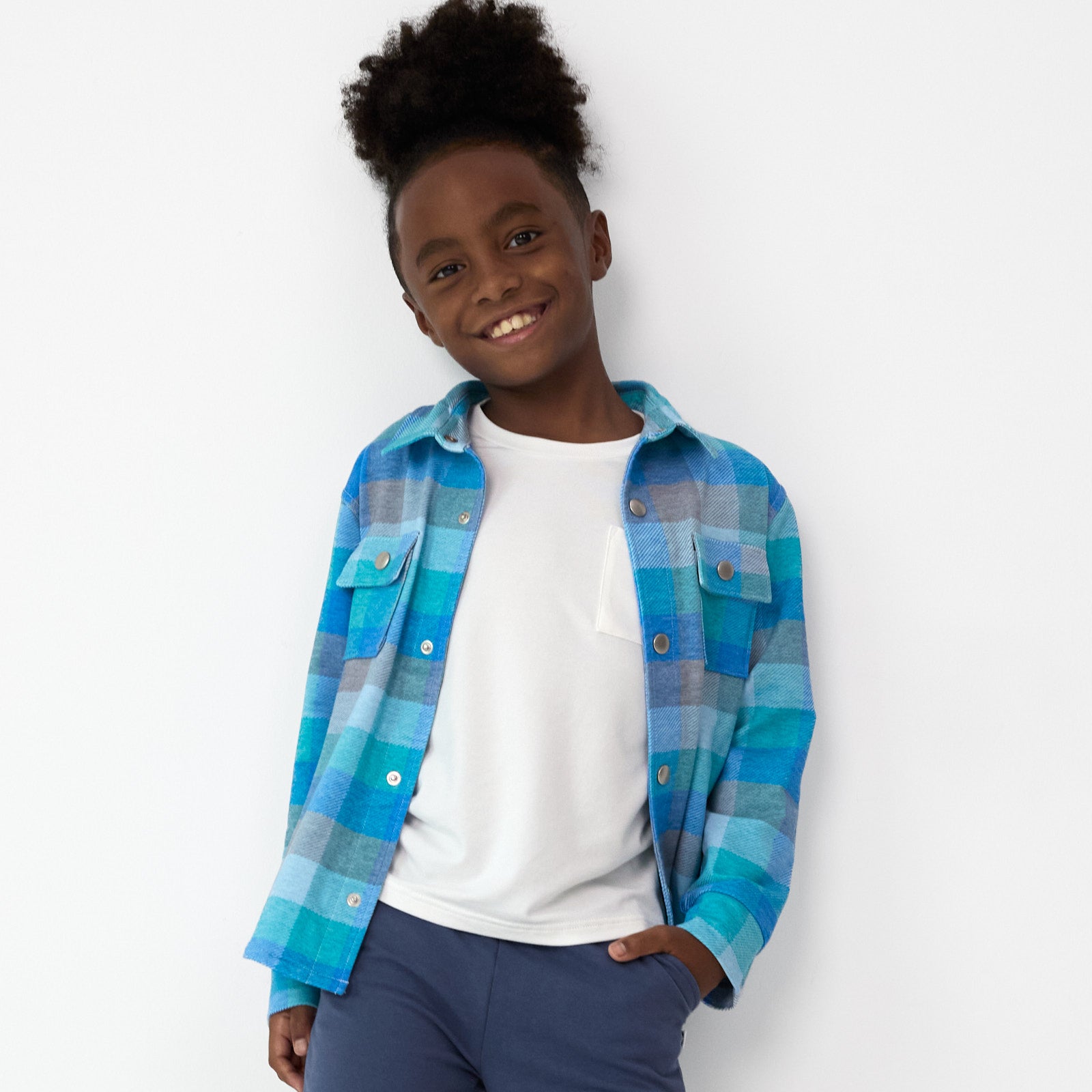 Additional image of smiling boy posing while wearing the Arctic Plaid Shacket and Vintage Navy Jogger