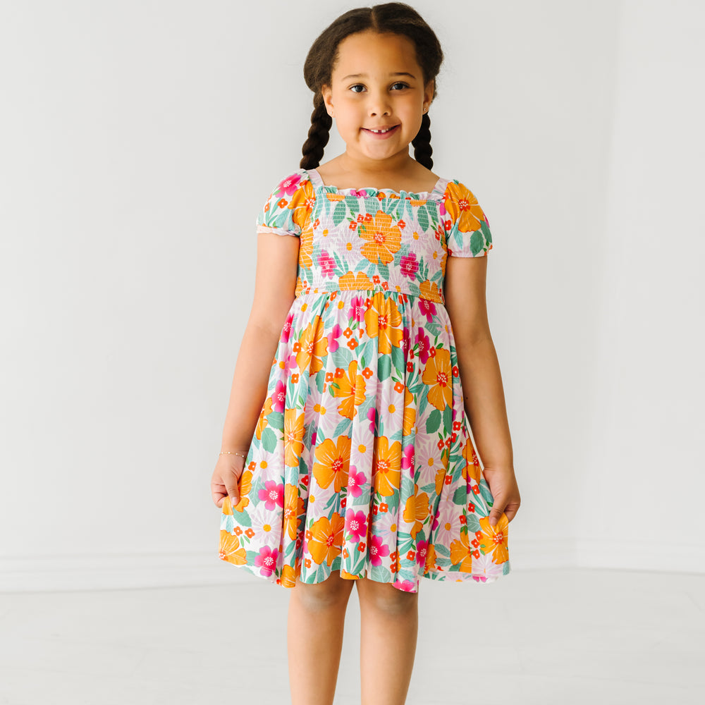 Child wearing a Beachy Blooms puff sleeve smocked dress