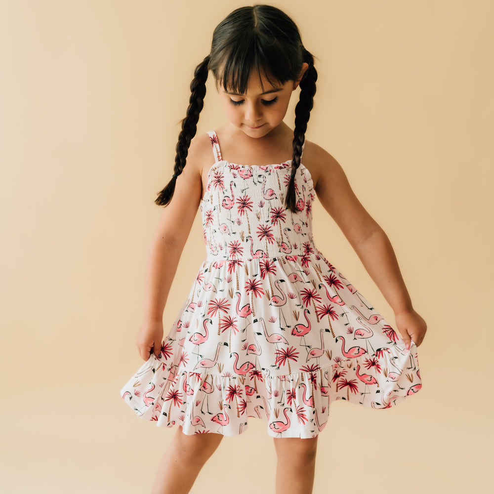 Alternate image of a child posing wearing a Pink Palms tank smocked dress