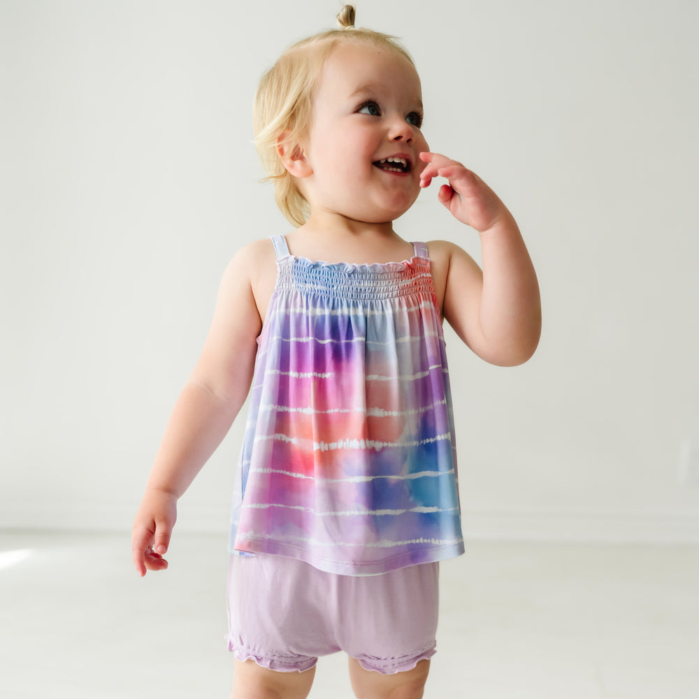 Close up image of a child wearing a Pastel Tie Dye Dreams tank smocked top with shorty bloomer