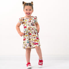 Child wearing a Radiator Springs skater dress