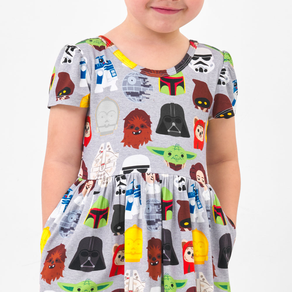 Close up image of a child wearing a Legends of the Galaxy skater dress