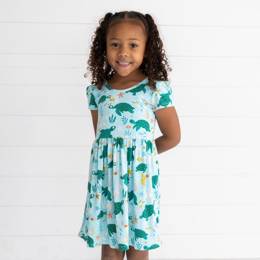 Image of a child wearing a Sea Turtle Friends Skater Dress