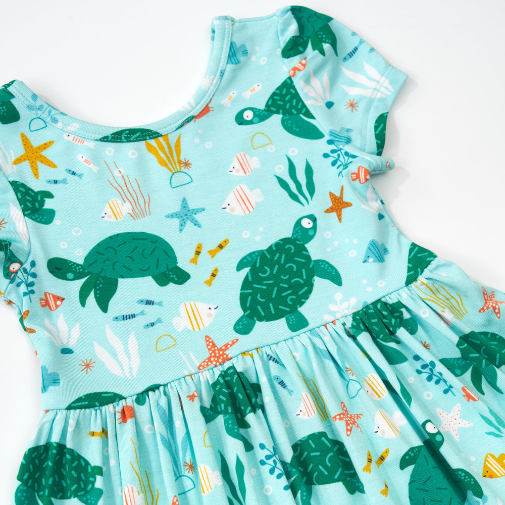 Close up detail shot of a Sea Turtle Friends Skater Dress with Bodysuit