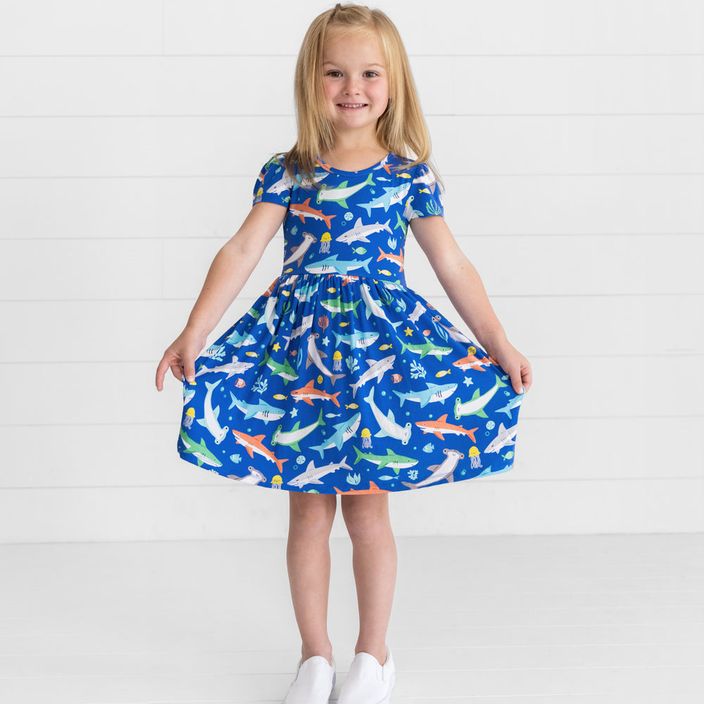 Smiling girl posing while wearing the Rad Reef Skater Dress