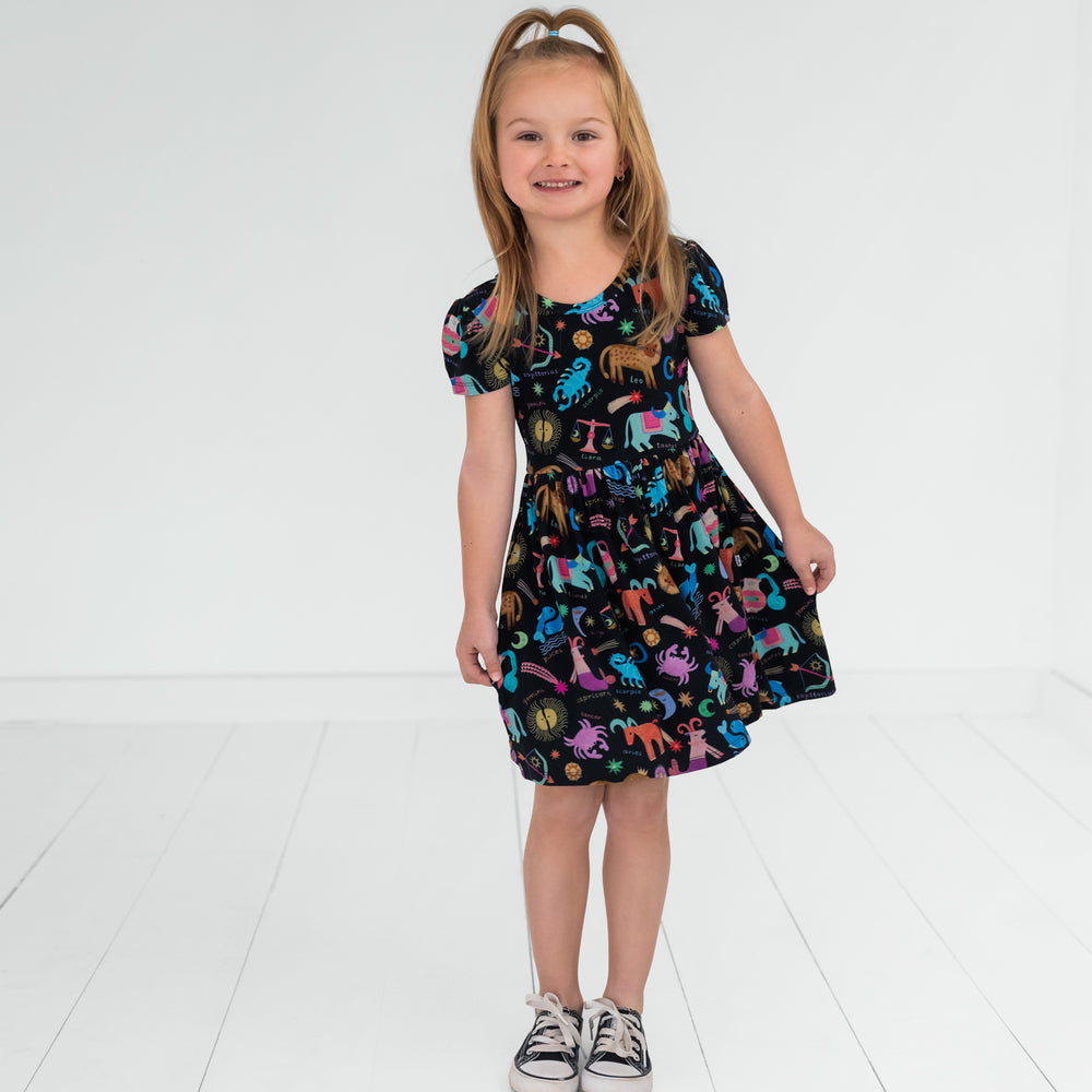 child wearing a star signs skater dress