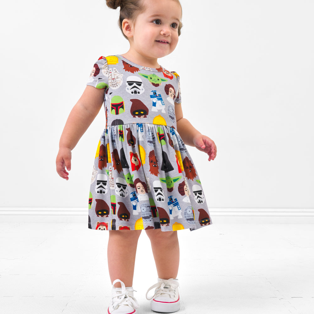 Child wearing a Legends of the Galaxy skater dress with bodysuit