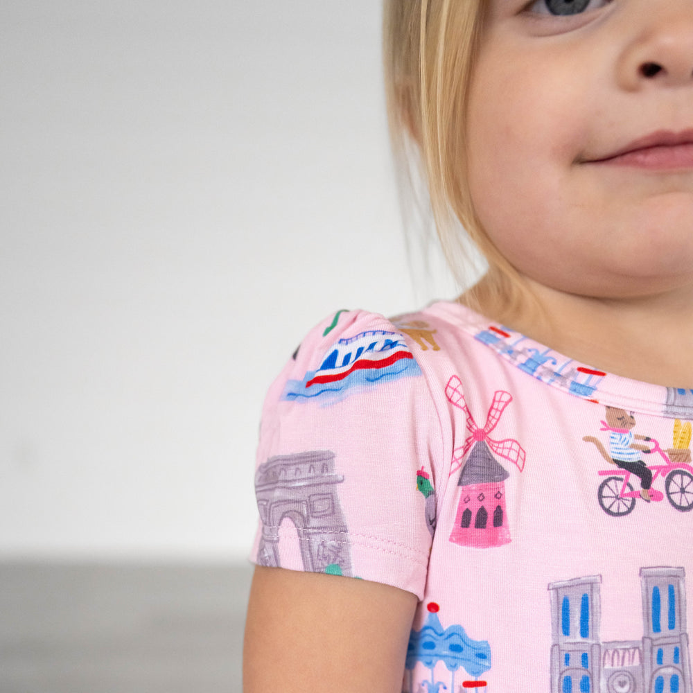 Close up image of the shoulder detail on the Pink Weekend in Paris Skater Dress with Bodysuit