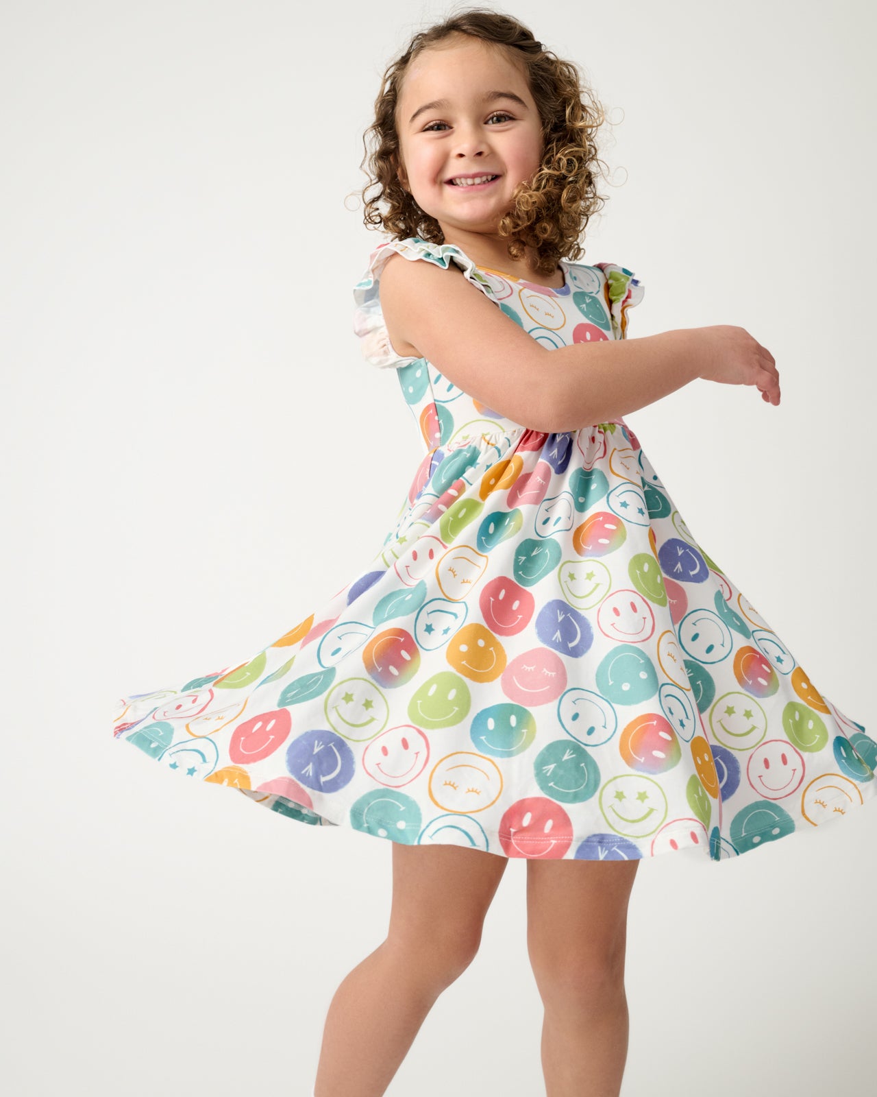 Twirling girls wearing the Positive Vibes Flutter Twirl Dress
