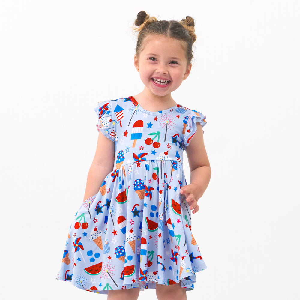 Child wearing a Stars, Stripes & Sweets flutter twirl dress