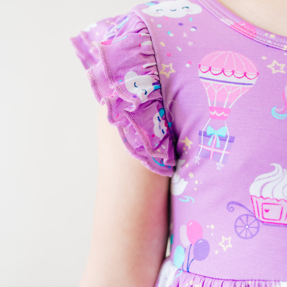 Close up image of the flutter sleeve on a Magical Birthday flutter twirl dress