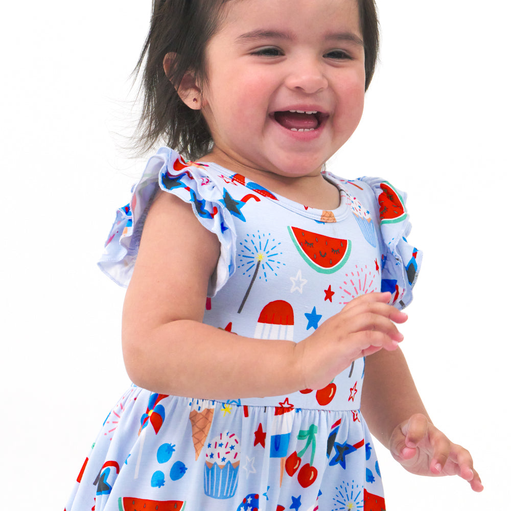 Close up image of a Stars, Stripes and Sweets flutter twirl dress with bodysuit