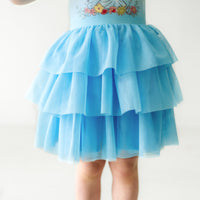 Alternate close up image of a child wearing a Cinderella flutter tiered tutu dress