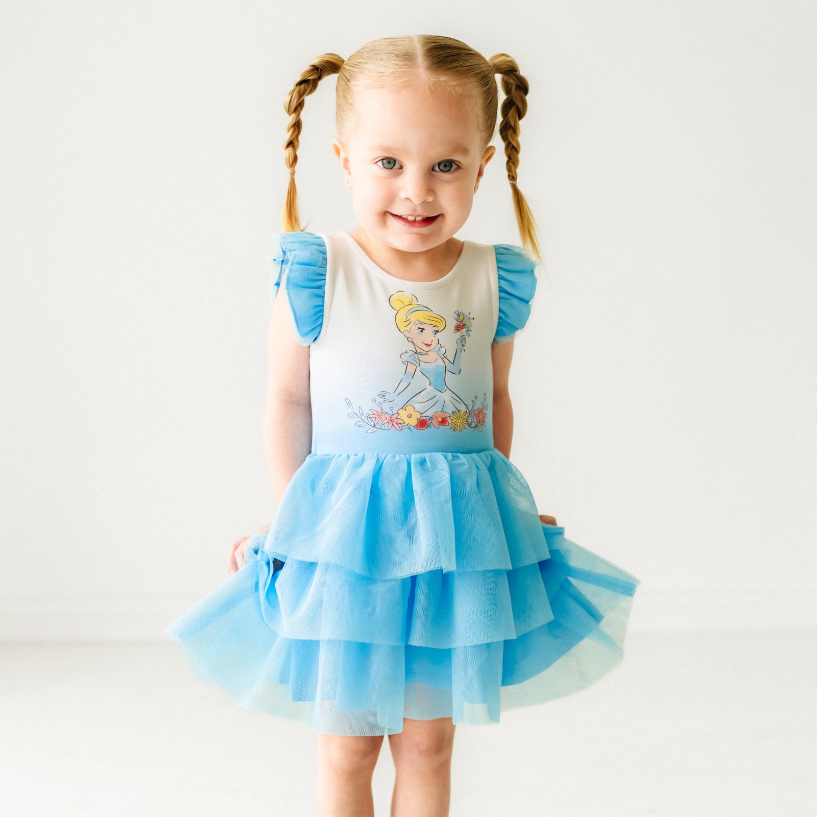 Child wearing a Cinderella flutter tiered tutu dress with bloomer