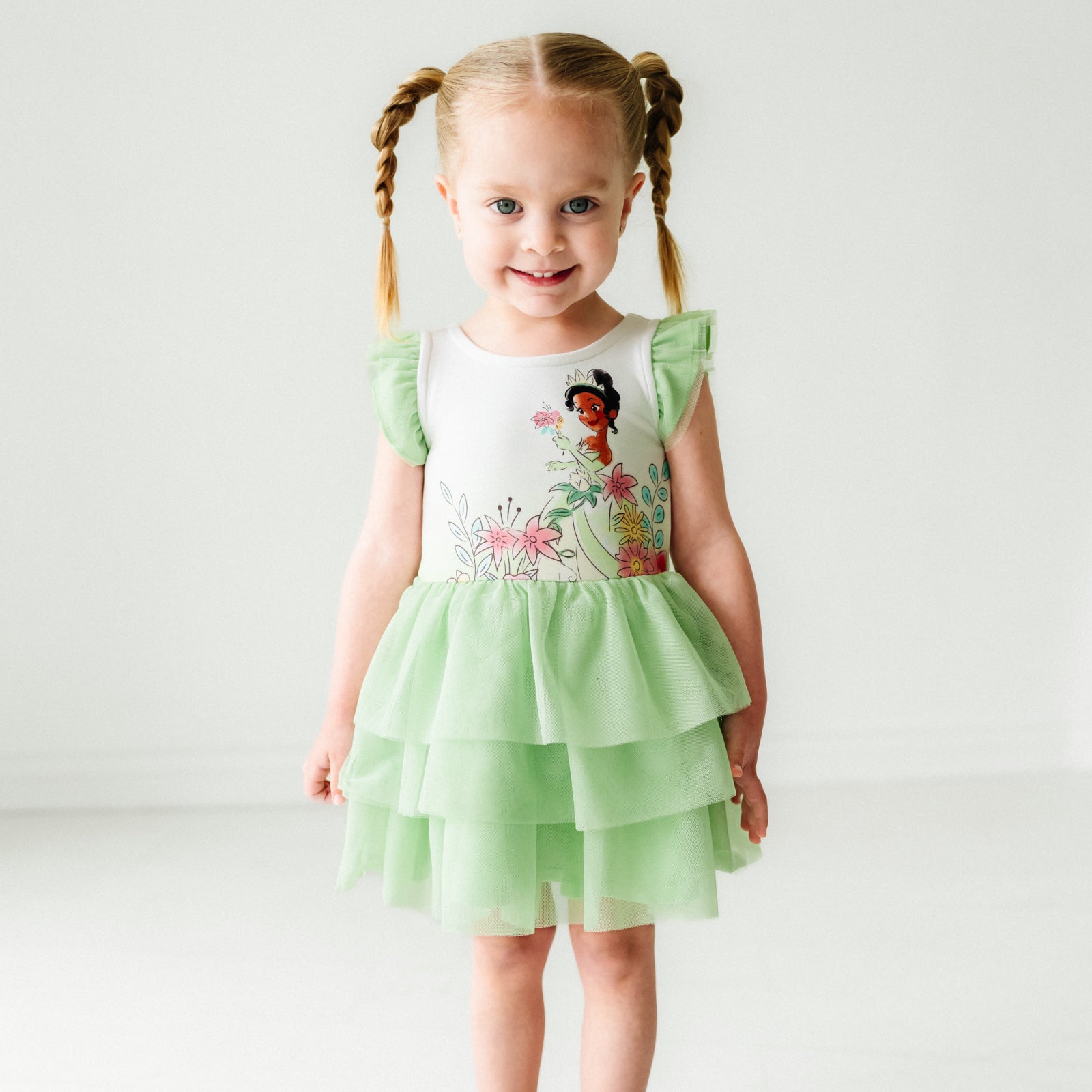 Child wearing a Tiana flutter tiered tutu dress with bloomer