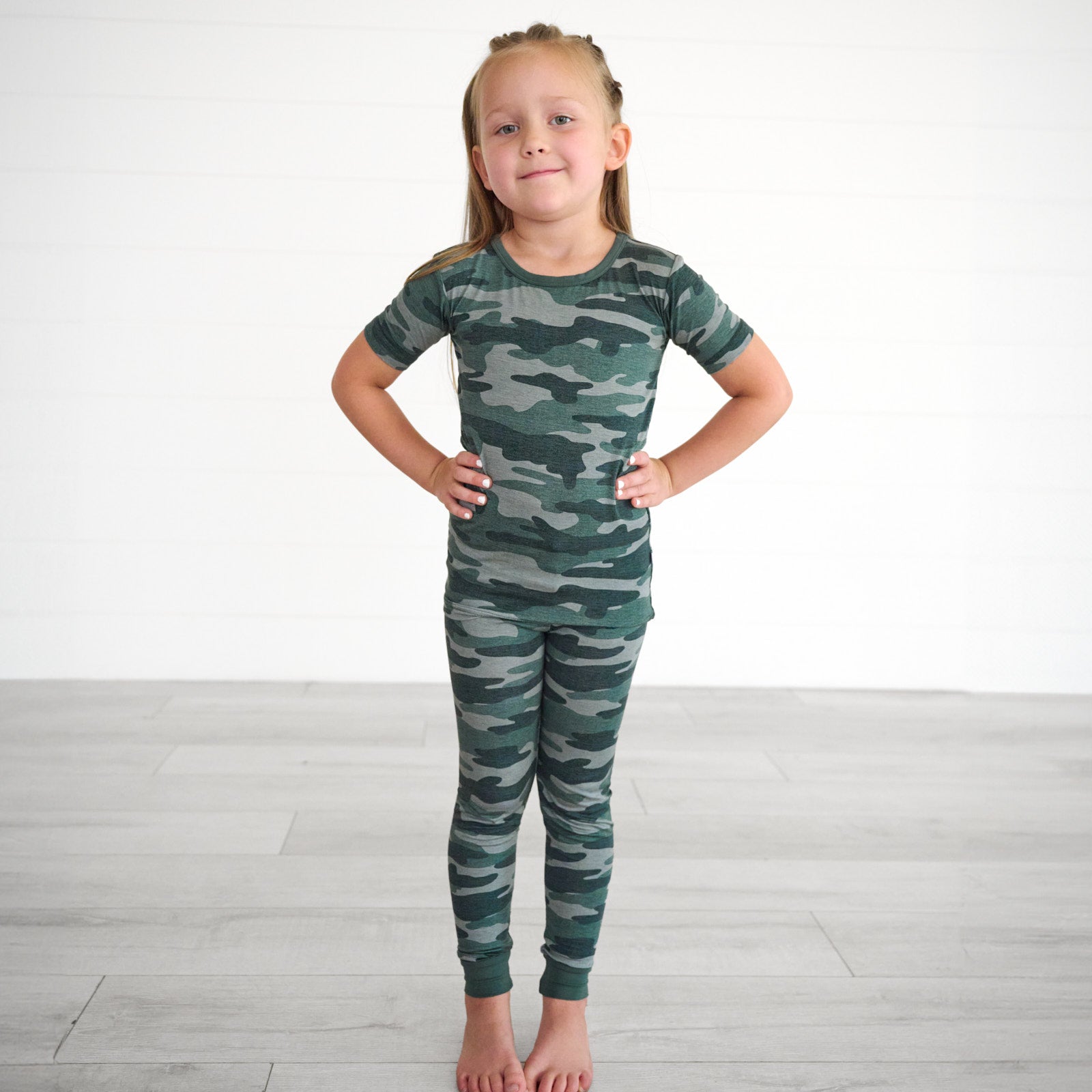 Girl wearing the Vintage Camo Two-Piece Short Sleeve Pajama Set