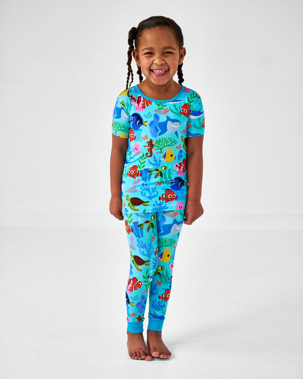 Standing girl wearing Disney Nemo's Reef Two-Piece Short Sleeve Bamboo Pajama Set