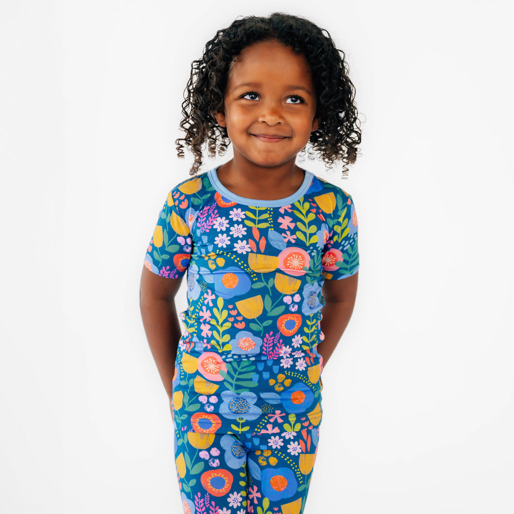 Close up image of the girl wearing the top to the Folk Floral Two-Piece Short Sleeve Pajama Set