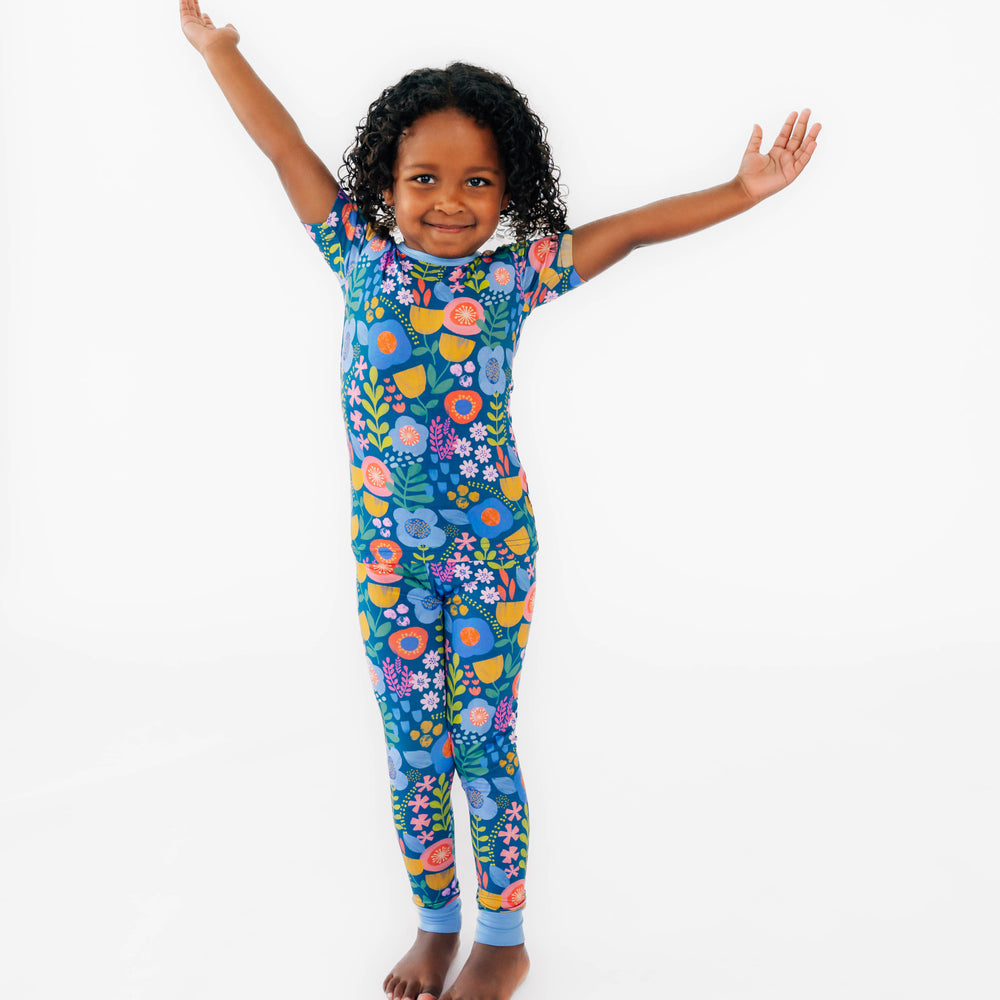 Girl posing wearing the Folk Floral Two-Piece Short Sleeve Pajama Set