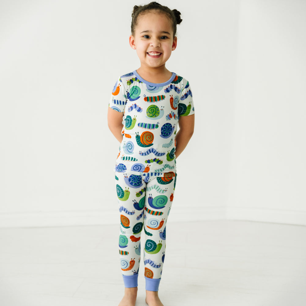 Child wearing an Inchin' Along two-piece short sleeve pajama set