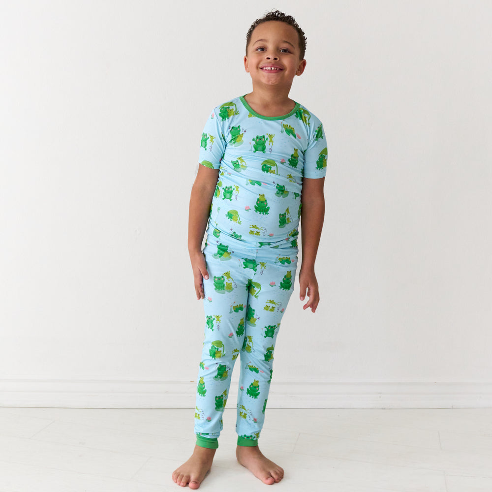 Child wearing a Leaping Love two-piece short sleeve pajama set