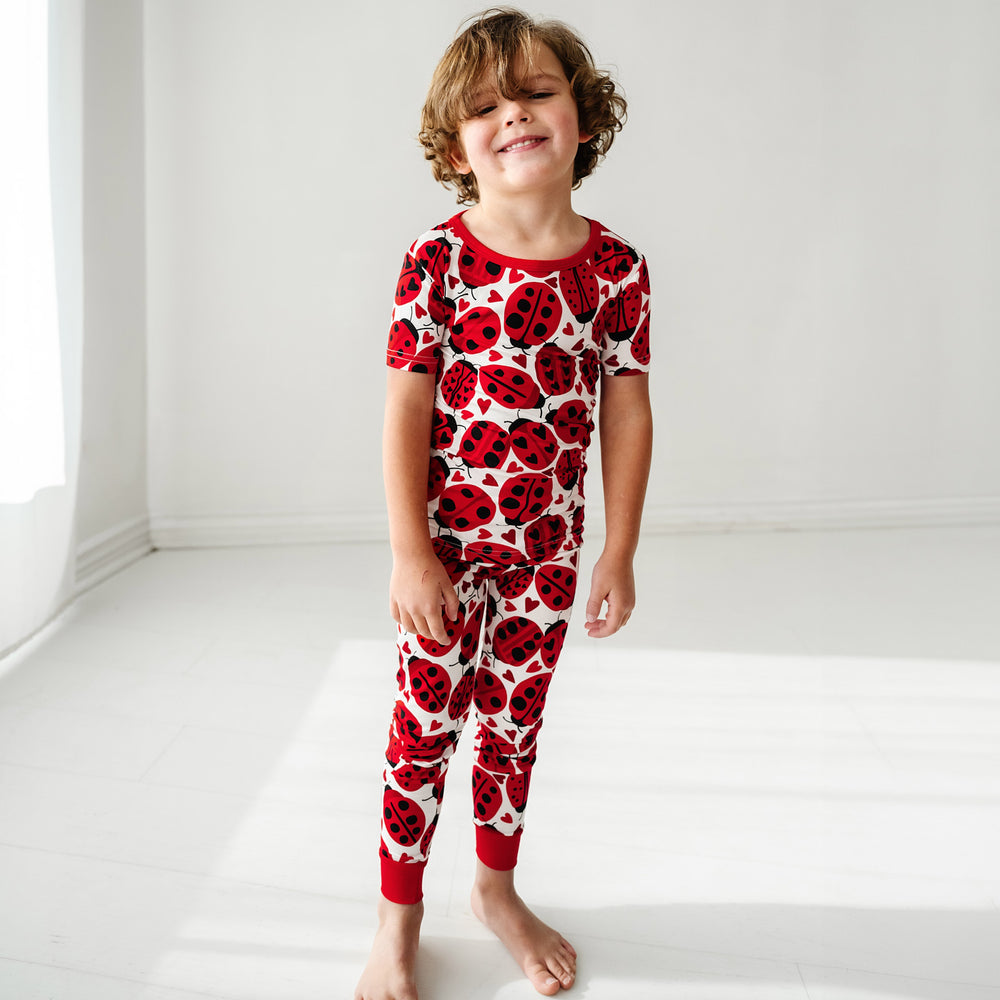 Click to see full screen - Alternate image of a child wearing a Love Bug printed two-piece short sleeve pajama set