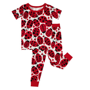Flat lay image of Love Bug printed two-piece short sleeve pajama set