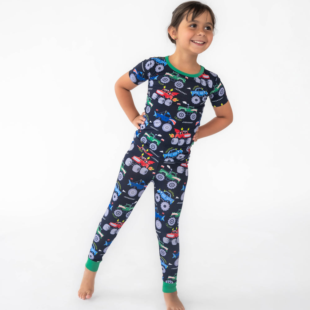 Girl posing in the Monster Truck Madness Two-Piece Short Sleeve Pajama Set