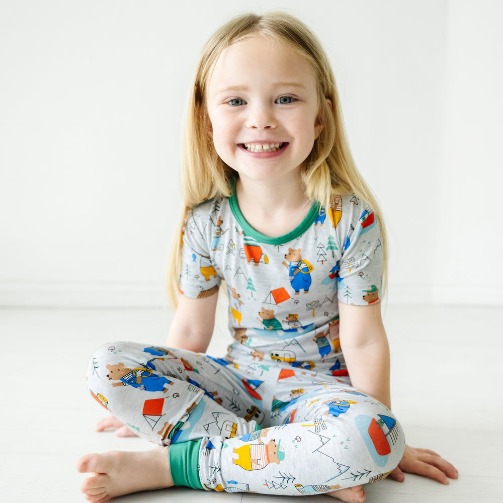 Child sitting wearing a Papa Bear two piece short sleeve pajama set