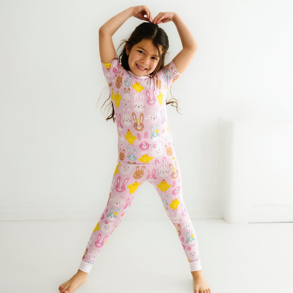 Click to see full screen - Alternate image of a child posing wearing a Pink Pastel Parade two piece short sleeve pajama set