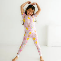 Alternate image of a child posing wearing a Pink Pastel Parade two piece short sleeve pajama set