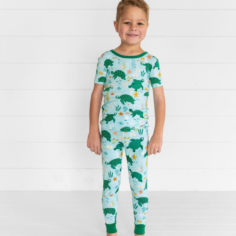 Image of a child wearing Sea Turtle Friends two piece short sleeve pj set