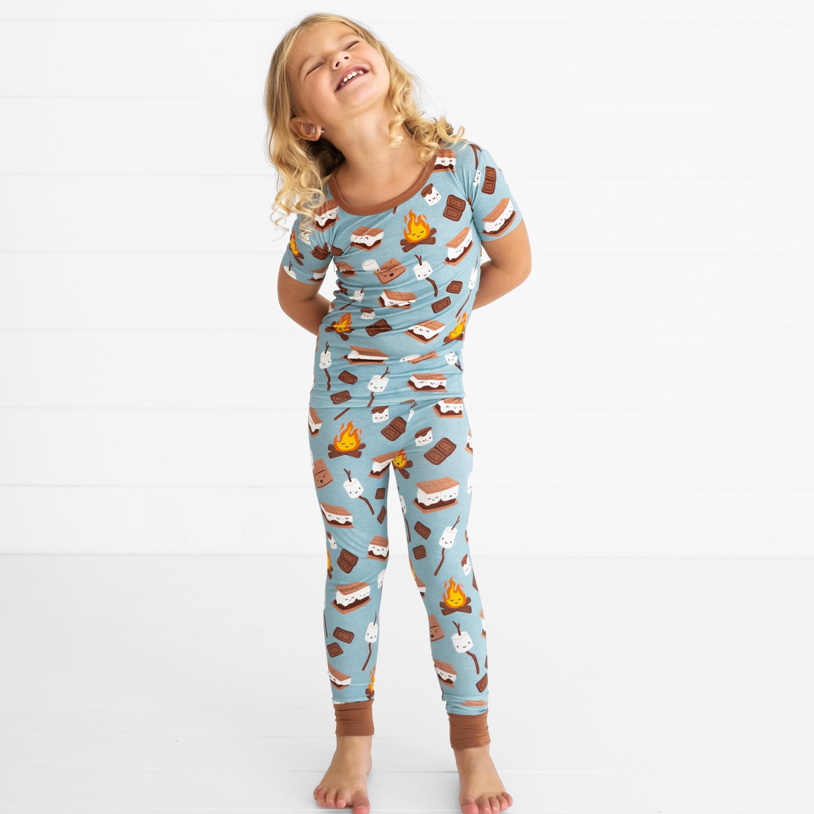 child posing a wearing S'mores Galore short sleeve two piece pj set