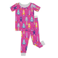Flat lay image of a Pink Space Explorer short sleeve two piece pajama set