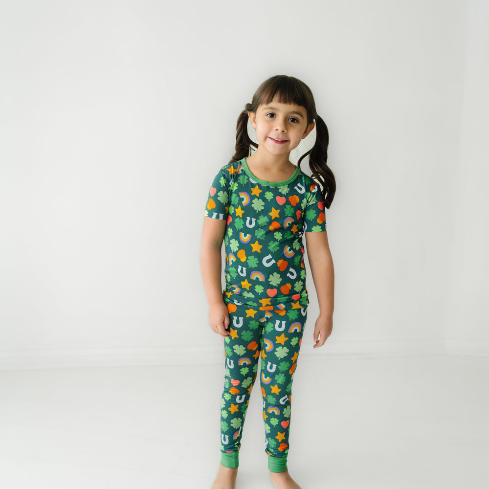 Click to see full screen - Child wearing a Lucky printed two piece short sleeve pajama set