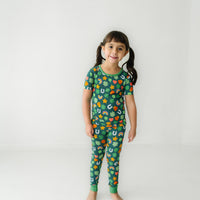 Child wearing a Lucky printed two piece short sleeve pajama set