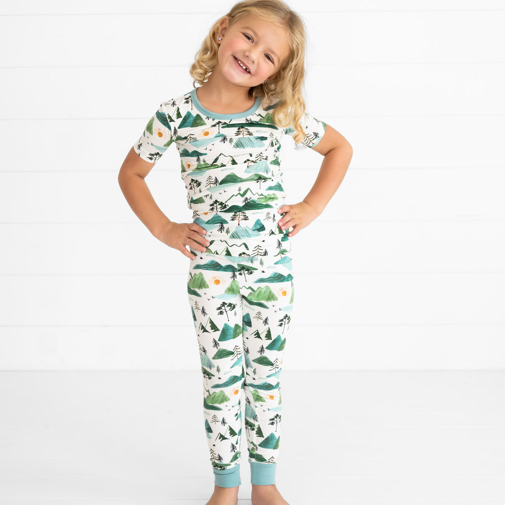 child posing wearing a Mountain Mist two piece short sleeve pajama set