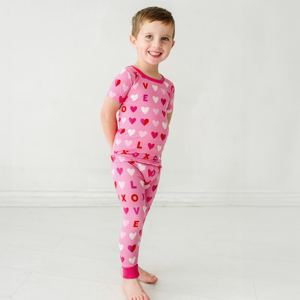 Click to see full screen - Third alternate image of a child wearing Pink XOXO two piece short sleeve pajama set