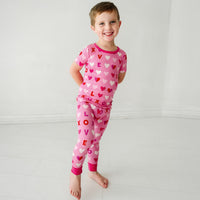 Child wearing Pink XOXO two piece short sleeve pajama set