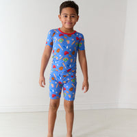 Child wearing Blue All Stars two piece short sleeve and shorts pajama set